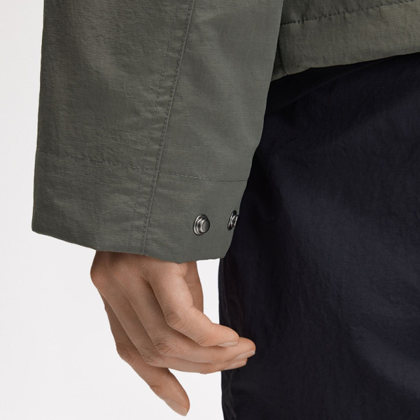 Model Wearing Fred Perry Cropped Ripstop Hooded Parka Jacket in Field Green - Close up cuff