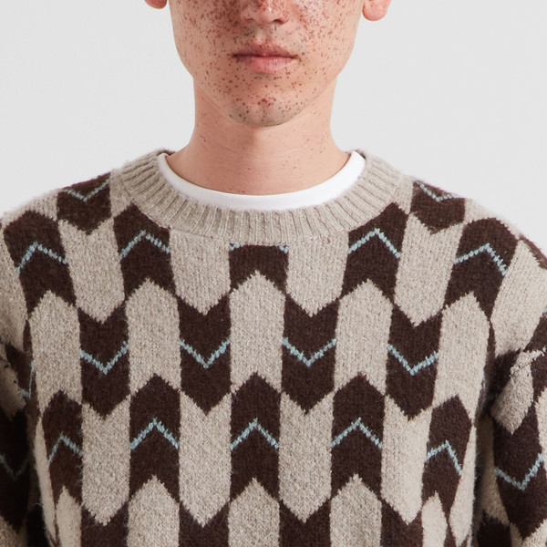 Model Wearing Farah Milt Men's Relaxed FairIsle Geo Jacquard Jumper in Dark Brown - Close up chest