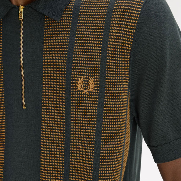 Textured knit detail on Fred Perry Textured Panel Knitted Zip Neck Polo Shirt in Night Green - Close up laurel wreath
