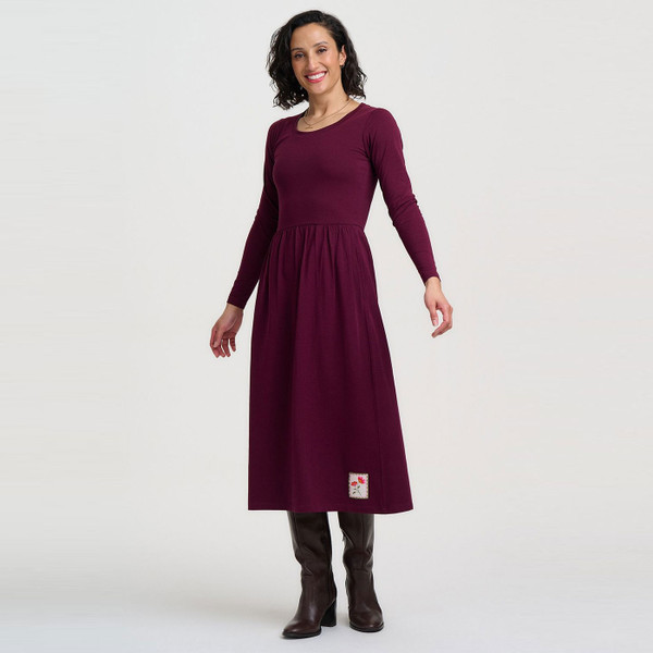 Woman wearing Sugarhill Brighton Abella Flower Patch Jersey Midi Dress in Wine