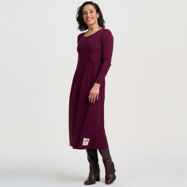 Woman wearing Sugarhill Brighton Abella Flower Patch Jersey Midi Dress in Wine