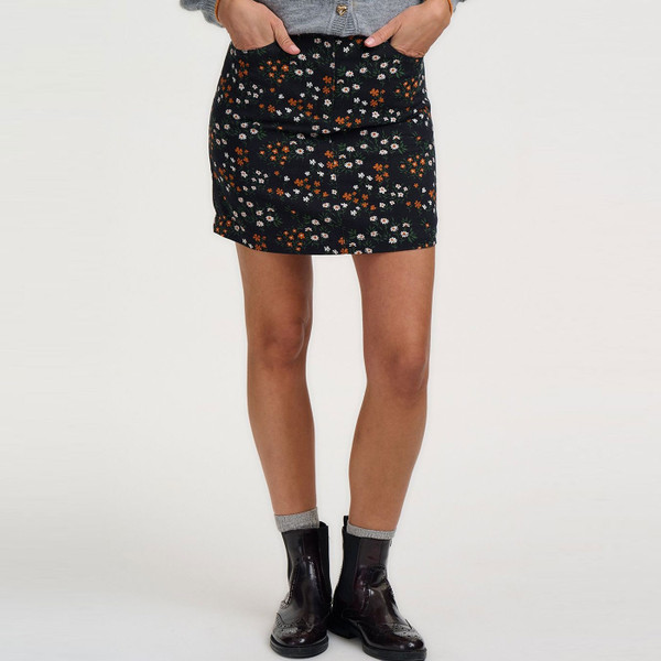 Woman wearing Sugarhill Brighton Alice Retro 70s Ditsy Floral Mini Skirt in Black