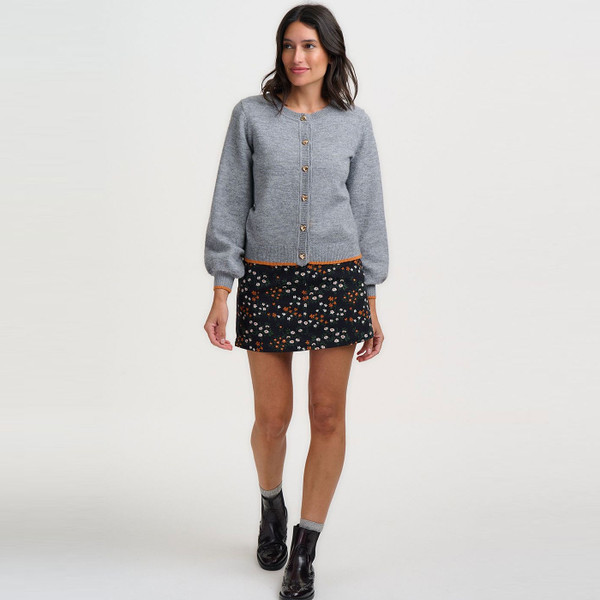 Woman walking in Sugarhill Brighton Alice Retro 70s Ditsy Floral Mini Skirt in Black
