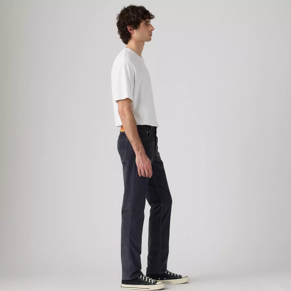 Model Wearing Levi’s 511 Slim Men's Black 14W Corduroy Jeans in Ebony - Side facing full length