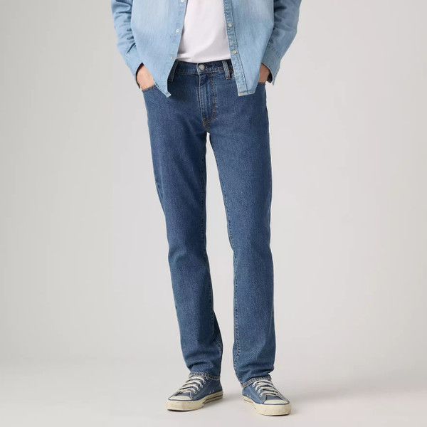 Model Wearing Levi's 511 Slim Men's Blue Denim Jeans in Laugh It Off - Front facing