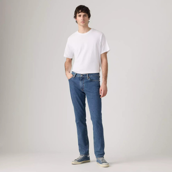 Model Wearing Levi's 511 Slim Men's Blue Denim Jeans in Laugh It Off - Front facing full length