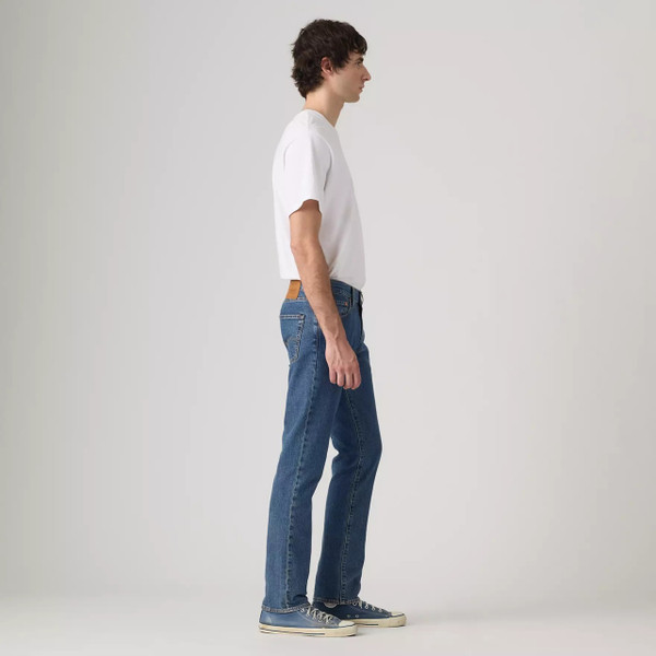Model Wearing Levi's 511 Slim Men's Blue Denim Jeans in Laugh It Off - Side facing full length