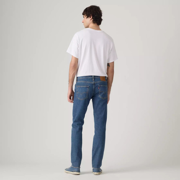 Model Wearing Levi's 511 Slim Men's Blue Denim Jeans in Laugh It Off - Back facing full length