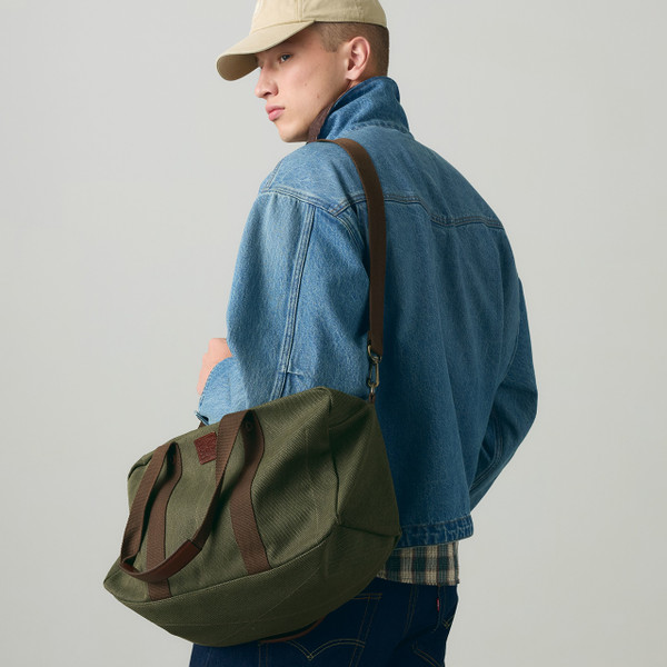 Model Carrying the Levi's Heritage Duffle Bag in Rosin - Retro Kit Bag - Back View