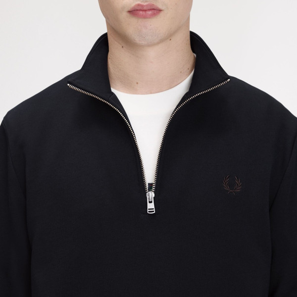 Model Wearing Fred Perry Half Zip Funnel Neck Sweatshirt in Navy / Brandy / Rich Brown - Close up chest zip open