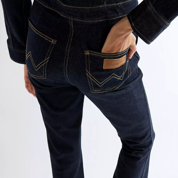Model Wearing Wrangler Women's Montana Regular Coverall Jumpsuit in Dark Stone - Back Close Up Pocket
