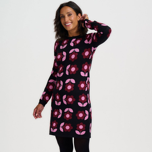 Woman wearing Sugarhill Brighton Ren Retro 70s Daisy Knitted Mini Dress in Black/Pink