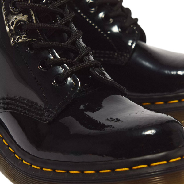 Eyelet and upper detail on Dr Martens Women's 1460 Patent Lamper 8 Eye Leather Boots in Black