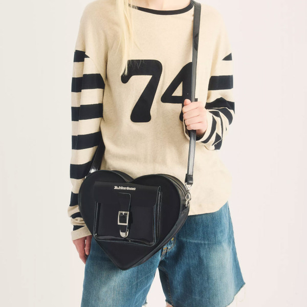 Dr Martens Leather Heart Shaped Bag in Black worn as crossbody bag