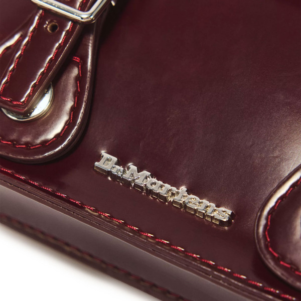 Dr Martens badge on Dr Martens 7 Inch Vegan Faux Leather Crossbody Satchel Bag in Cherry Red