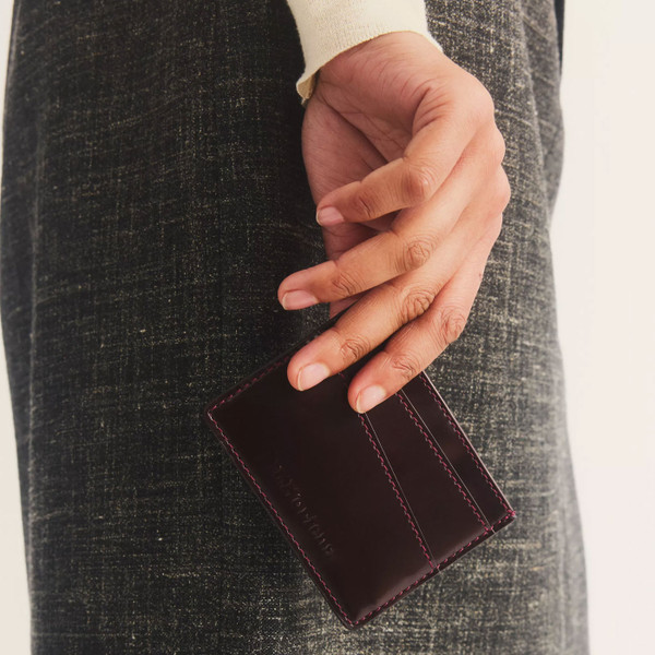 Man holding Dr Martens Cardholder II Oxford Rub Off Leather Wallet in Cherry Red