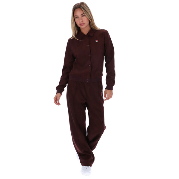 Woman wearing Fila Vintage Women's Dreamer Retro 70s Faux Suede Jacket in Fudge brown with matching pants