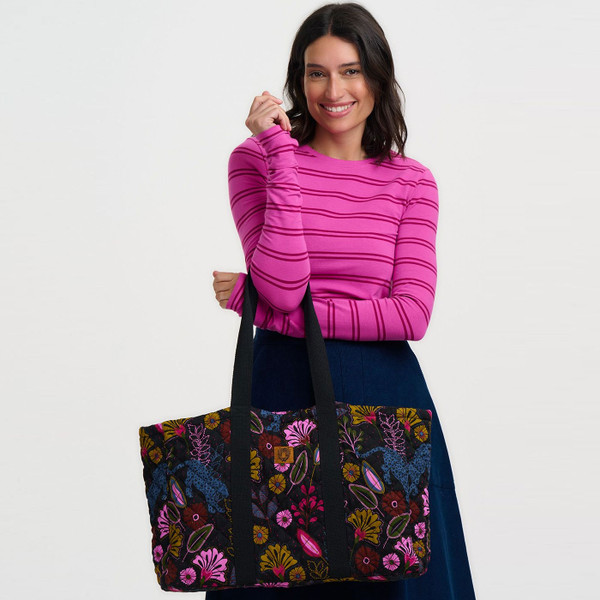 Woman holding Sugarhill Brighton Haven Jungle Panther Quilted Tote Bag in Black