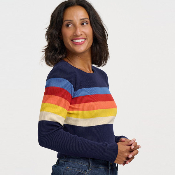 Woman wearing Sugarhill Brighton Cayla Rainbow Stripes Ribbed Jumper in Navy