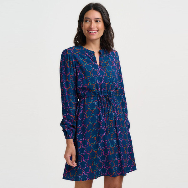 Woman wearing Sugarhill Brighton Flora Rainbow Stars Mini Party Dress in Teal