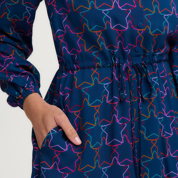 Pocket and long sleeves on Sugarhill Brighton Flora Rainbow Stars Mini Party Dress in Teal