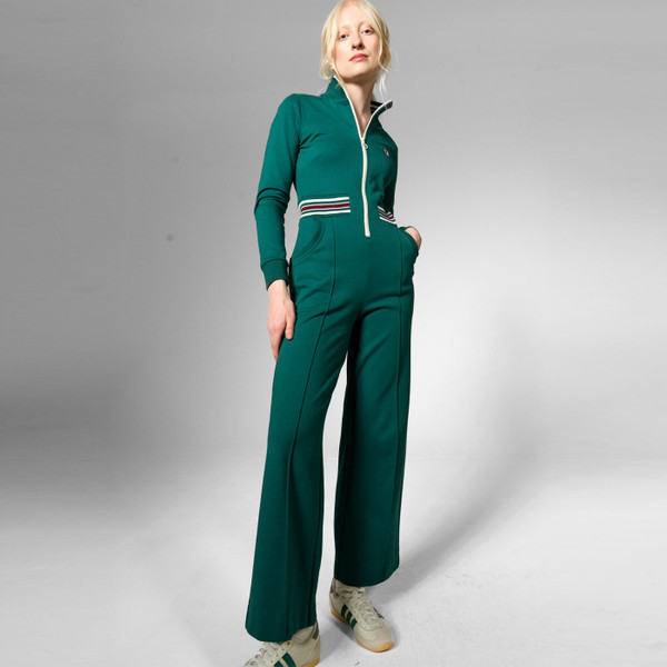 Woman wearing Mademoiselle YeYe Retro 70s Power Track Jumpsuit in Green