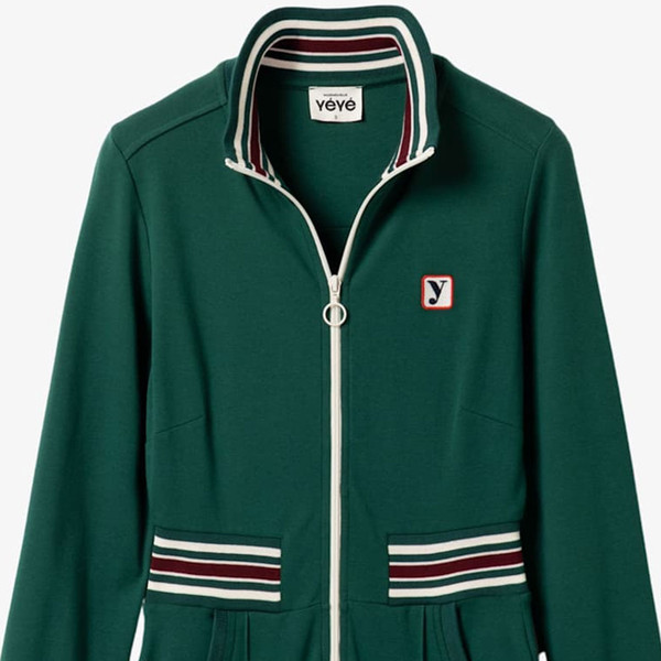 Collar and zip up front on Mademoiselle YeYe Retro 70s Power Track Jumpsuit in Green