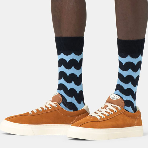Man wearing Happy Socks Wobbly Stripe Retro Socks in Dark Navy/Blue