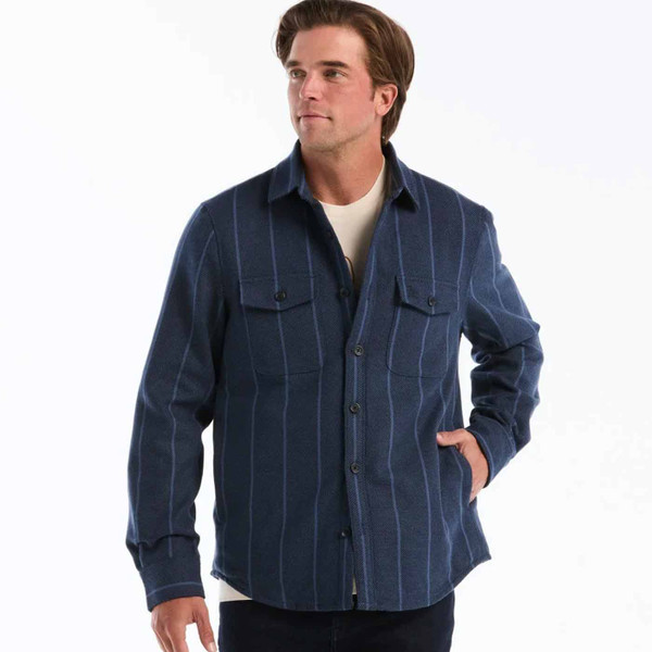 Man wearing Original Penguin Men's Striped Twill Overshirt in Dark Sapphire