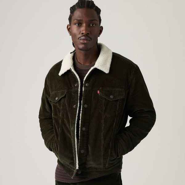 Model Wearing the Levi's Type III Corduroy Sherpa Trucker Jacket Rosin - Hand in Pockets