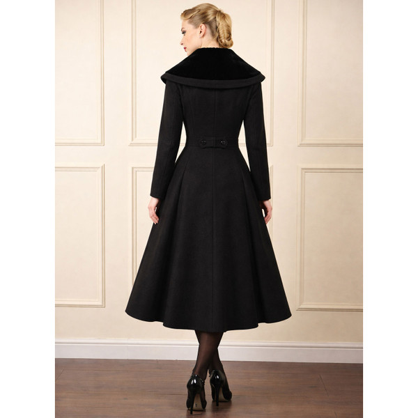 Woman wearing Banned Retro Clotilde Women's 50s Vintage Swing Coat in Black