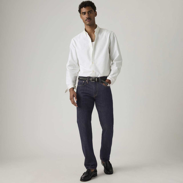 Model Wearing white shirt with Levi's 502 Taper Jeans in Sta-Dark