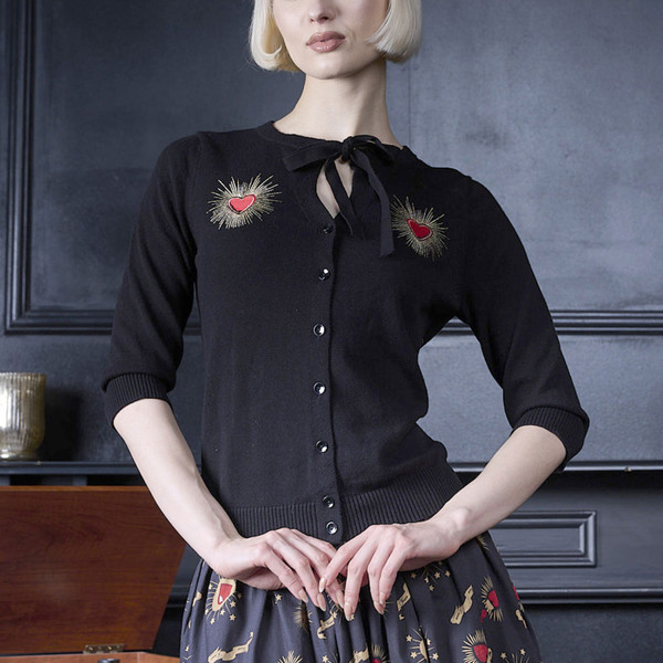 Woman wearing Banned Retro Mia True Love Neck Tie 50s Cardigan in Black