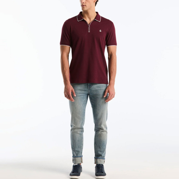 Man wearing Original Penguin Interlock 1/4 Zip Tipped Polo in Port Royale Red