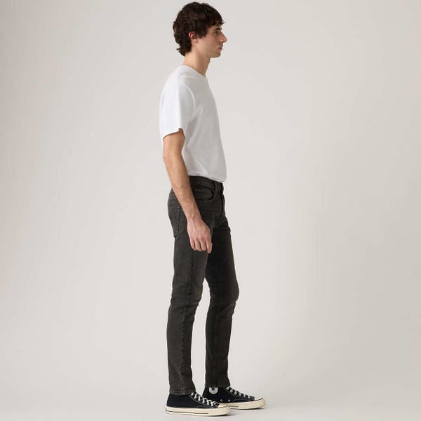 Model Wearing Levi's 512 Slim Taper Denim Jeans Evening Stars Advanced Pictured From Side