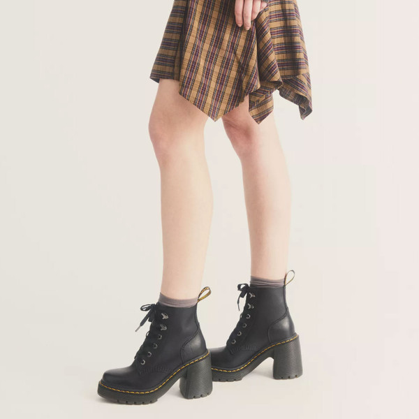 Woman wearing Dr Martens Women's Jesy Leather Heeled Boots in Black