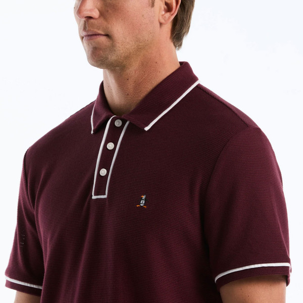 Model Wearing Original Penguin Icons Earl Mesh Bentley Polo Shirt in Port Royale - Front close up