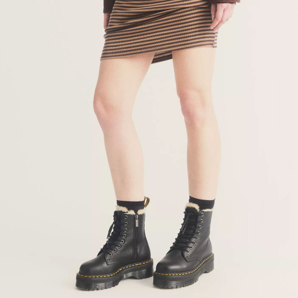 Woman wearing Dr Martens Jadon Faux Fur Lined Leather Retro Platform Boots in Black