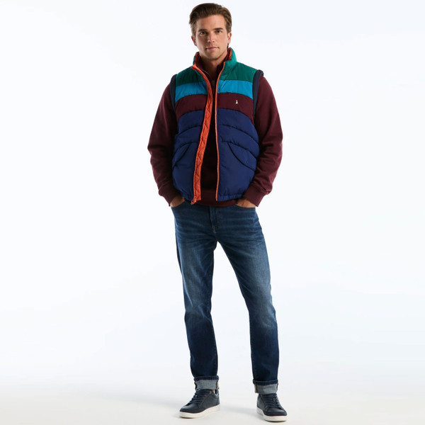 Man wearing Original Penguin Icons Colourblock Quilted Gilet in Blue Depths