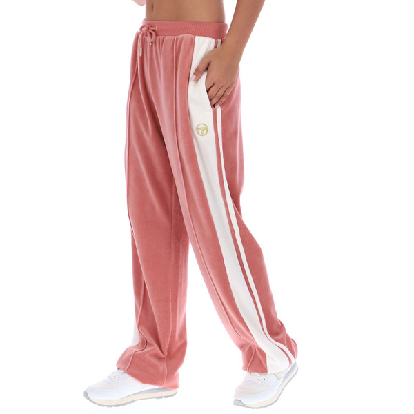 Woman wearing Sergio Tacchini Women's Erica Velour Track Pants in Light Mahogany Pink