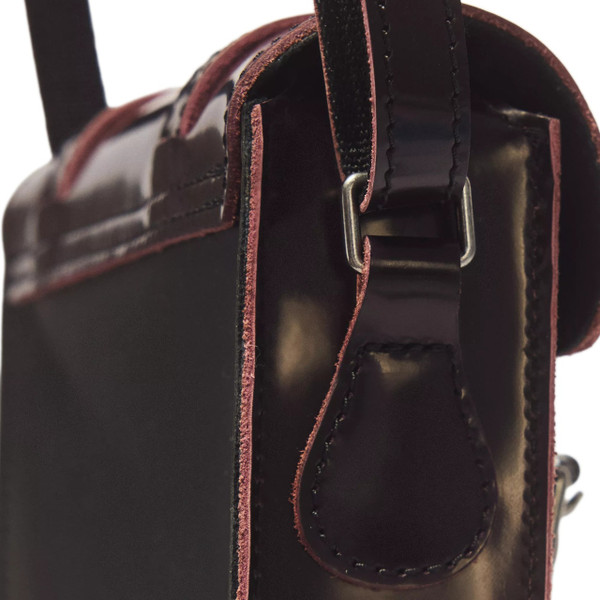 Side close up on Dr Martens Women's 7 Inch Whimsigoth Arcadia Leather Crossbody Satchel in Purple / Black