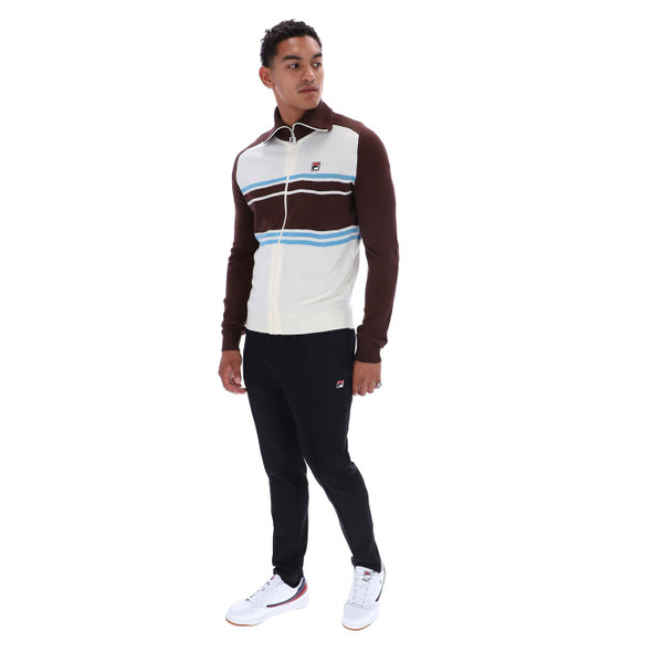 Man wearing Fila Vintage Men's Lena Zip Through Knitted Track Top in Gardenia/Fudge