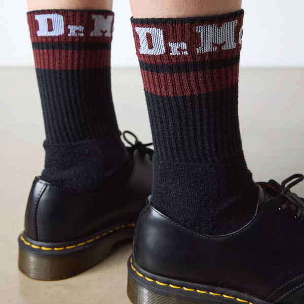 Person wearing Dr Martens Athletic Logo Socks in Black with Cherry Red and White AC681004