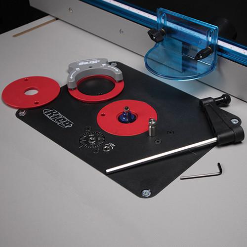 A woodworker using the Kreg Precision Router Lift PRS3000 integrated into a router table, demonstrating its practical application for shaping wood pieces with precision.
