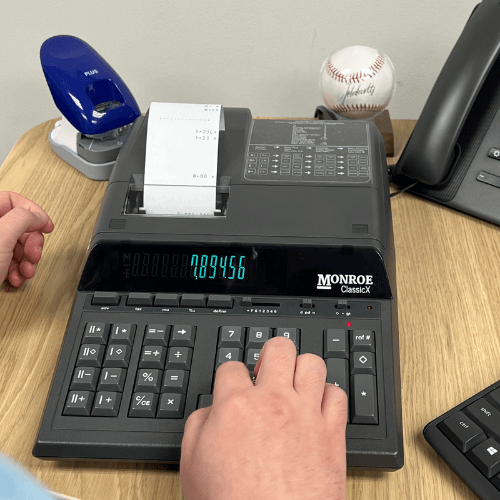 Monroe ClassicX Heavy-Duty Printing Calculator in use