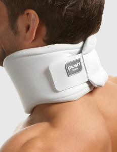 Push Care Neck Brace worn around the neck showing anatomical fit and adjustable hook-and-loop fastening for comfortable cervical support.