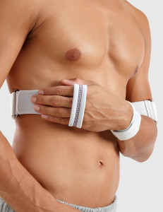 Front view of Push med Shoulder Brace wrapped around upper arm and torso, demonstrating adjustable chest strap and arm positioning for shoulder stabilisation.