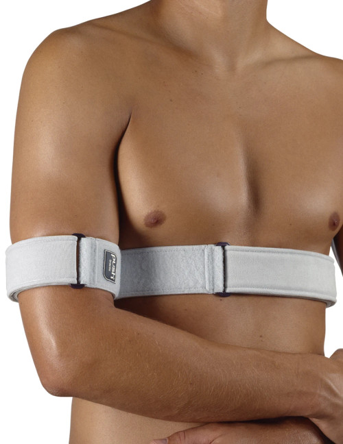 Man wearing Push med Shoulder Brace with arm secured across chest, showing neutral shoulder immobilisation support for post-injury or post-surgery recovery.