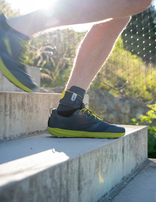 Ankle brace in use during outdoor jogging, offering secure support without restricting movement