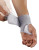 Hand fitting Push care wrist brace showing easy wrap design and secure hook-and-loop closure for daily wrist support.